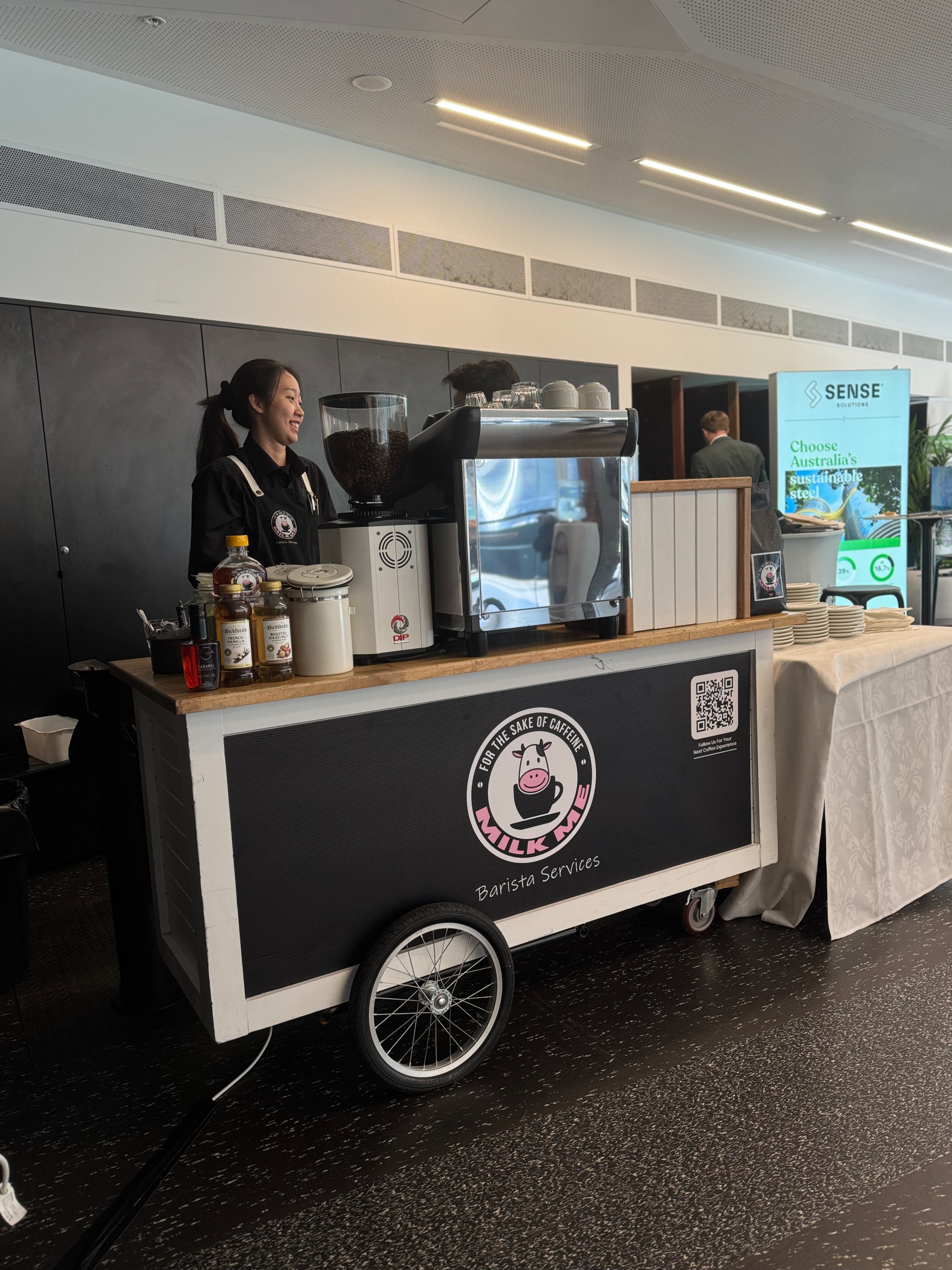 MILK ME barista at a brand event